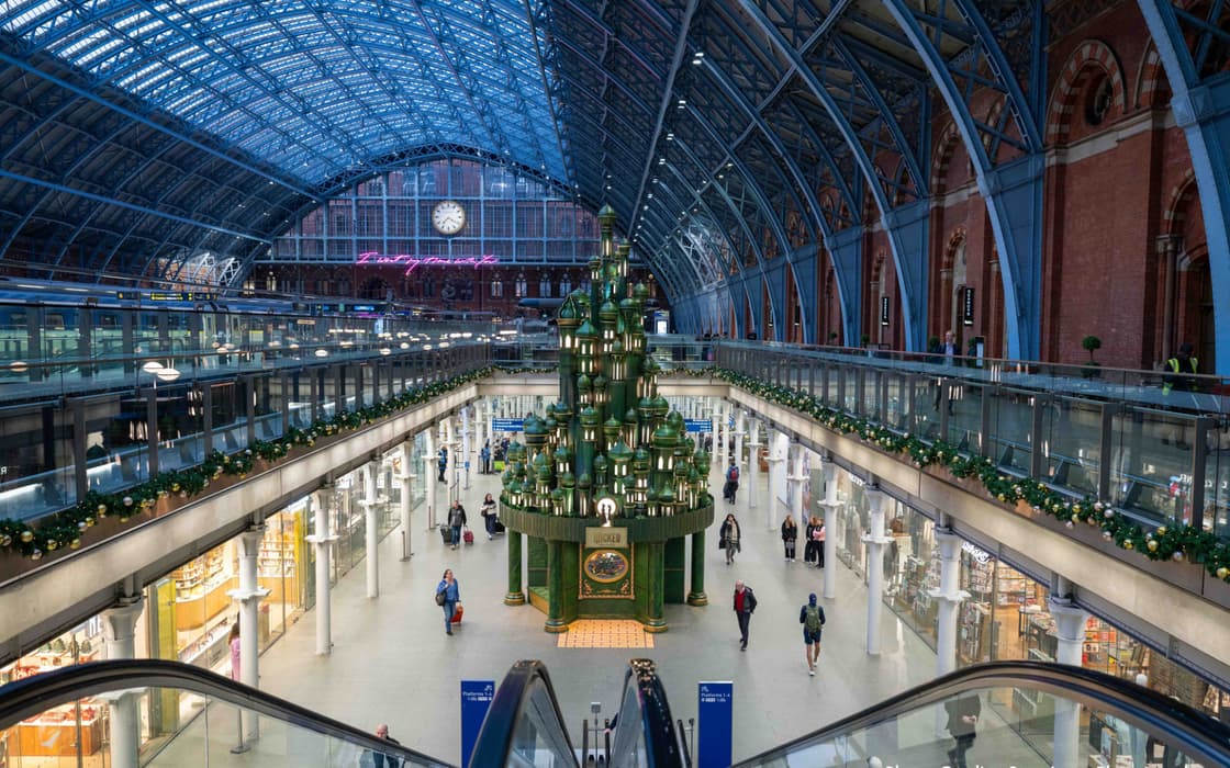 A view from the St Pancras escalators of the Wicked Christmas tree in all its emerald picturesqueness.